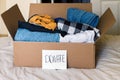 Close-up of Cardboard box full of clothes to donate Royalty Free Stock Photo