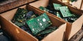 Close up of cardboard boxes filled with computer circuit boards for recycling