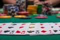 Close-up cards for playing poker on a gaming table in a casino against a background of chips. Background for a gaming business Royalty Free Stock Photo