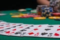 Close-up cards for playing poker on a gaming table in a casino against a background of chips. Background for a gaming business Royalty Free Stock Photo