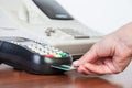 Close-up of cards servicing with POS-terminal Royalty Free Stock Photo