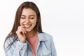 Close-up carefree emotive alluring brunette woman in denim jacket, enjoy funny amusing party, close eyes smiling