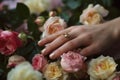 Close up of careful manicured womans hands against blooming roses. Generative AI