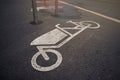 cargo bike symbol on tarmac at an urban bicycle parking space.