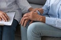 Close up doctor holding older woman patient hand, expressing support