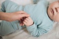 Close Up of Caring Mother Holding Tiny Hand of Baby Royalty Free Stock Photo