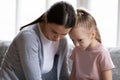 Close up caring young mother calming offended little daughter Royalty Free Stock Photo
