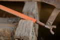 Close up of Carpenter sawing a board with a hand wood saw Royalty Free Stock Photo