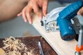 Close-up of a carpenter using a circular saw. Royalty Free Stock Photo