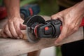 Close up of a carpenter using a circular saw to cut a wood, Carelessness at work concept Royalty Free Stock Photo