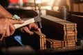 Close-up of a carpenter using a circular saw or a tool . Royalty Free Stock Photo