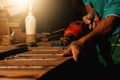 Close-up of a carpenter using a circular saw or a tool Royalty Free Stock Photo