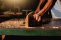 Close-up of a carpenter using a circular saw or a tool Royalty Free Stock Photo