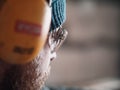 Close-up of a carpenter wearing safety goggles and headphones. carpentry workshop