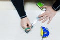 Close up Carpentry, mans hand using tape measure to measure wood plank and marking it with pencil. view from above Royalty Free Stock Photo