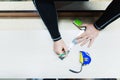 Close up Carpentry, mans hand using tape measure to measure wood plank and marking it with pencil. view from above Royalty Free Stock Photo