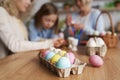 Close up of carton of colored Easter eggs in the table Royalty Free Stock Photo