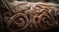 a close up of a carved object on a table or bench with a blurry image of the design on the back of the seat