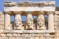 close-up of carved stone pediment on greek temple