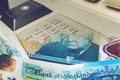 Close up of Cash Machine Keypad Blended with Five Pound Note Royalty Free Stock Photo