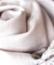 Close up of a cashmere scarf, pink fabric, piece of clothing, woolen texture Royalty Free Stock Photo