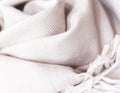 Close up of a cashmere scarf, pink fabric, piece of clothing, woolen texture Royalty Free Stock Photo