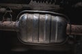 Close-up of Catalytic Converter in Car Exhaust System. The concept of preserving ecology, reducing harmful emissions into the air