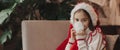Close-up Caucasian child, lovely baby girl in Santa hat, makes cherished wish and cute presents, surrounded by Christmas Royalty Free Stock Photo
