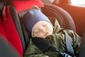 Close Up caucasian cute baby boy sleeping in modern car seat. Child traveling safety on the road. Safe way to travel Royalty Free Stock Photo