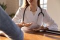 Caucasian female doctor consult patient at meeting