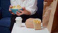 Close up of caucasian hands holding bowl of chips