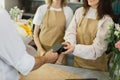 Close up of caucasian male hands using electronic credit card on his smartphone paying for purchase Royalty Free Stock Photo