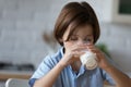 Close up Caucasian 8s boy drinking fresh milk at home Royalty Free Stock Photo