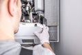 Contractor Repairing Central Heating Furnace System Royalty Free Stock Photo