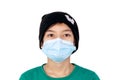 Close-up of caucasian teen boy  with face mask looking into camera. Attentive people with protection over mouth and nose from fron Royalty Free Stock Photo