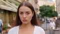Close up Caucasian unhappy girl street city annoyed woman frowning emotions displeased disappointed dissatisfied angry Royalty Free Stock Photo