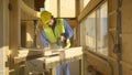 CLOSE UP: Worker building a hardwood house is trimming a gypsum wallboard.