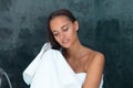 Close up of caucasian young woman drying her hair with a towel in the bathroom at home Royalty Free Stock Photo