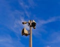 CCTV tower and loudspeaker in park with blue sky background Royalty Free Stock Photo