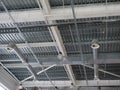 A close-up of a ceiling in a huge shopping centre. Inside view of iron structure construction as a background. Industry Royalty Free Stock Photo