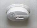 Close up of a ceiling mount white smoke detector used in homes. Royalty Free Stock Photo