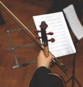 Close up of cello with bow in hands