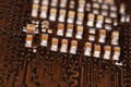 Close up ceramic capacitors on electronic circuit board