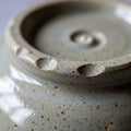 Ceramic object with a speckled, glossy glaze. The surface is grayish with Royalty Free Stock Photo