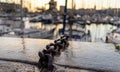 Close-up of a chain in la rochelle harbor. Boats in the background