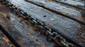 Chain on wooden bench with water droplets Royalty Free Stock Photo