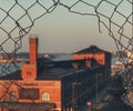 close-up of chainlink fence against sky during sunset Royalty Free Stock Photo