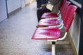 Close up on Chairs for patient and visitor in hospital, defocused people