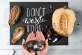 Close up of a chalkboard with Don`t waste food lettering and rotten fruits Royalty Free Stock Photo