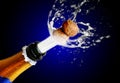 Close up of champagne cork popping Royalty Free Stock Photo